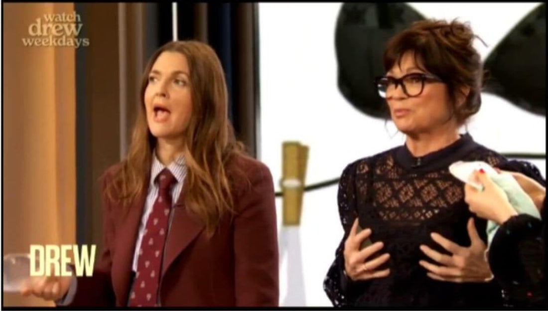 Drew Barrymore holding Evenly Bra Balancer