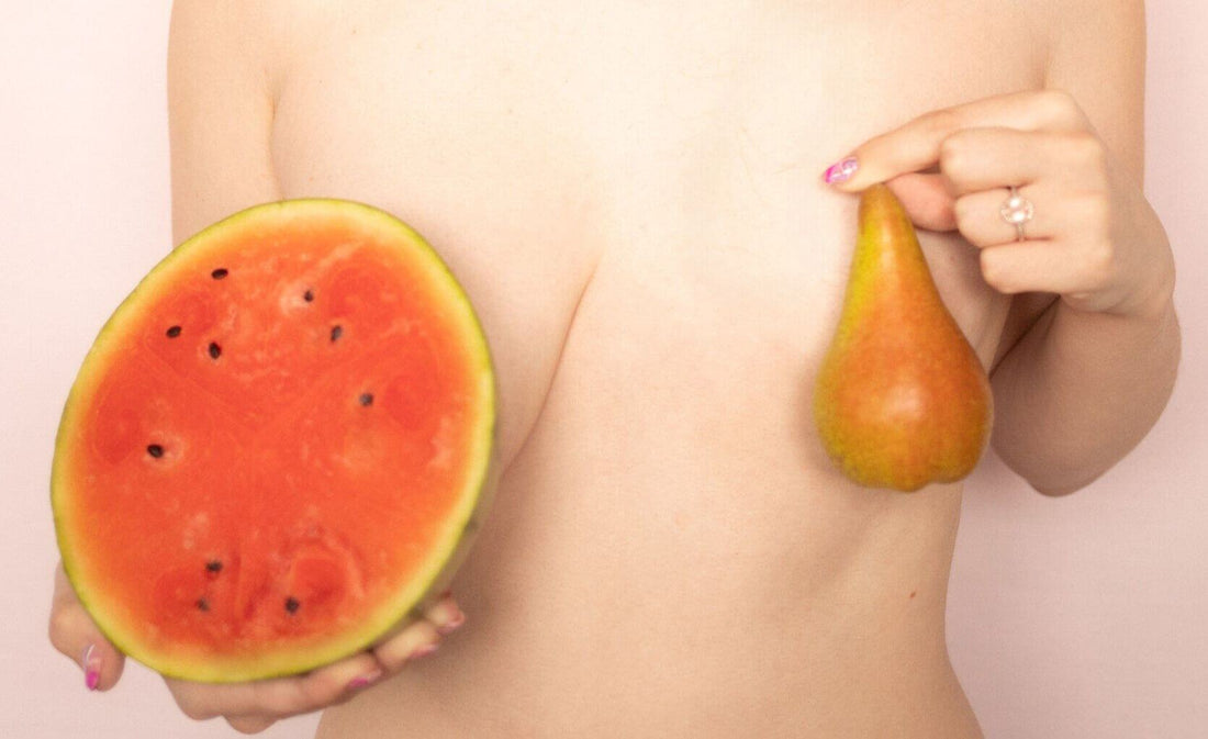 Woman with Uneven Breasts Holding Evenly Bra Balancers (bra inserts)