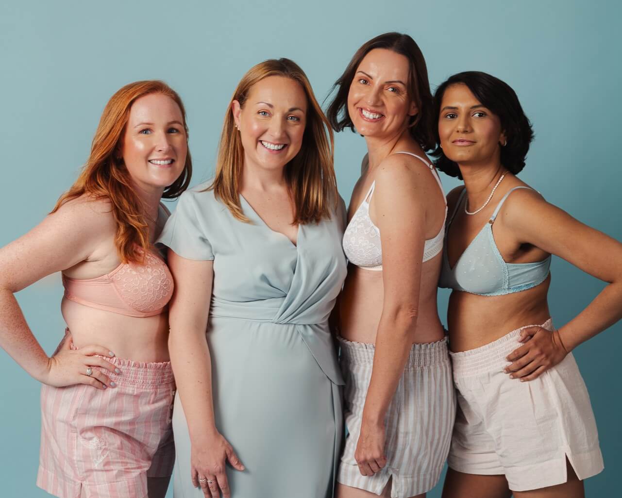 Group of models smiling wearing Evenly bra inserts for breast asymmetry